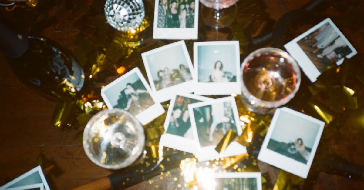 Wine Glasses And Pictures On Table