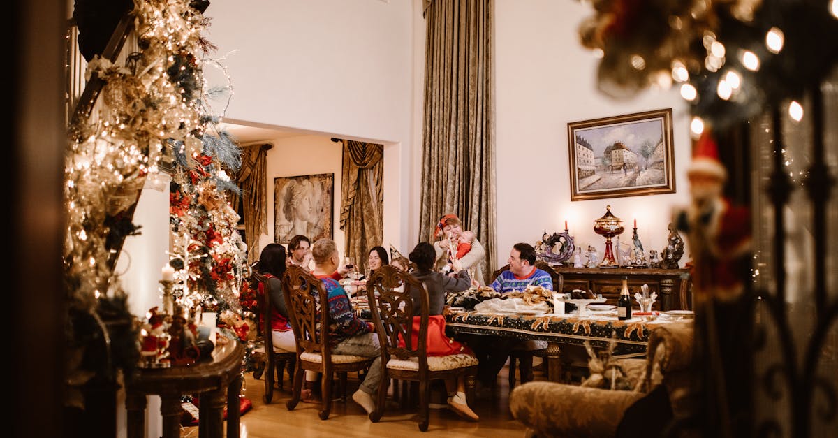 People Sitting on Wooden Chairs at Dining Table